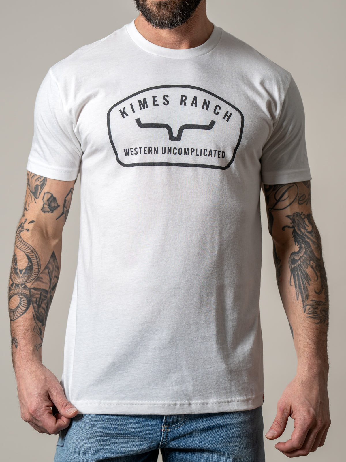 Kimes Ranch Hunton White t-shirt with a black Kimes Ranch logo and Western Uncomplicated text