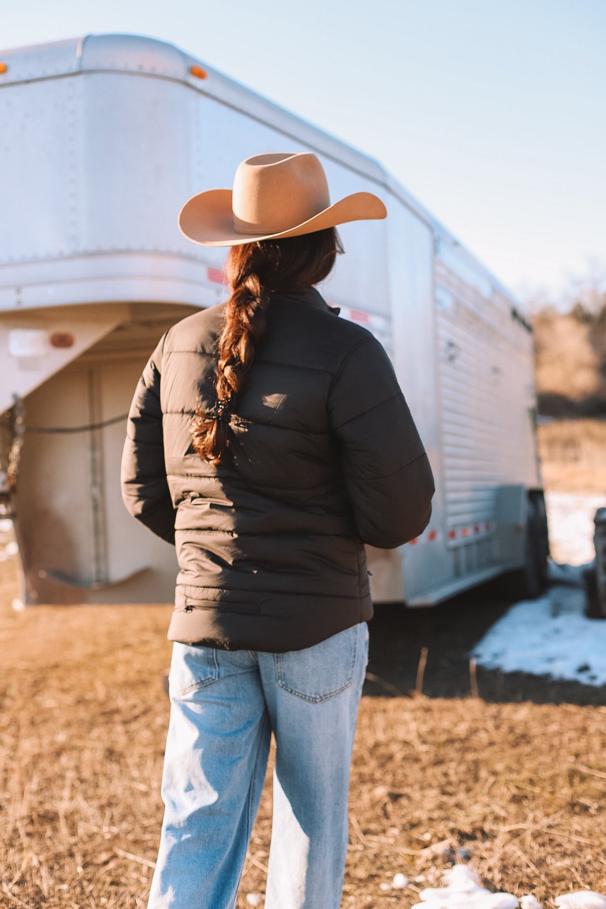 Kimes Ranch Valencia Puffy jacket in Black, back view, with horizontal quilting and long sleeves