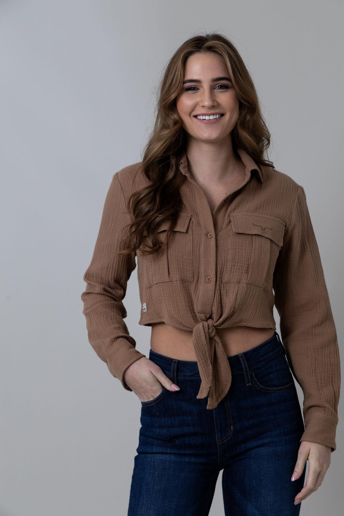 Kimes Ranch Torrean Tie Up top in Taupe with long sleeves and a front tie detail