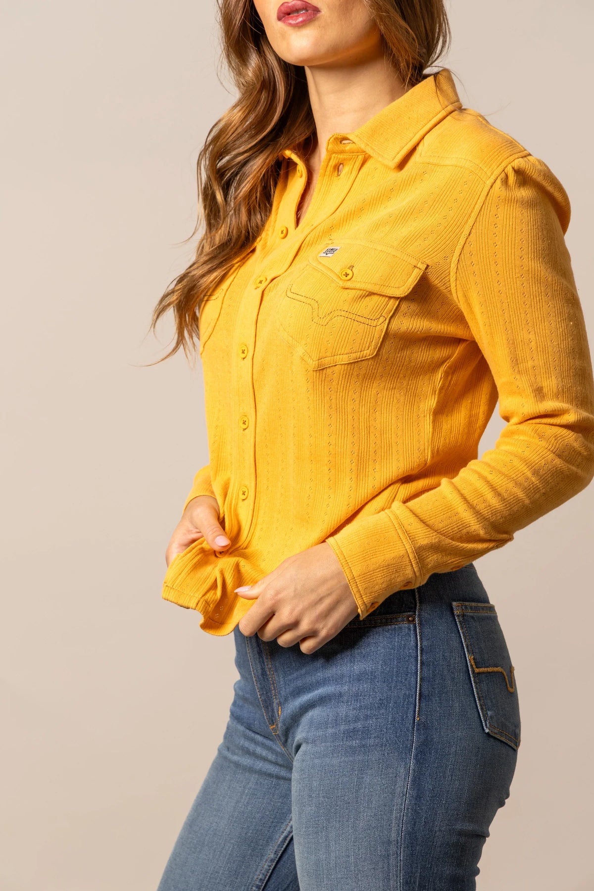 Kimes Ranch Isabel Pointelle top in Yellow Ochre, side view, with long sleeves and front pockets