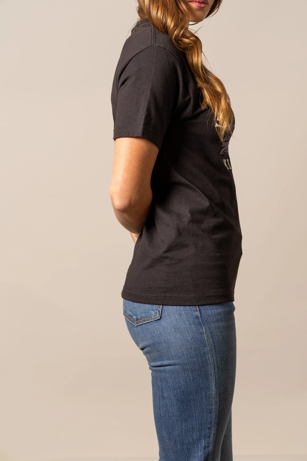 Kimes Ranch It's Cool to be Kimes shirt in Black, side view, with short sleeves and a side graphic