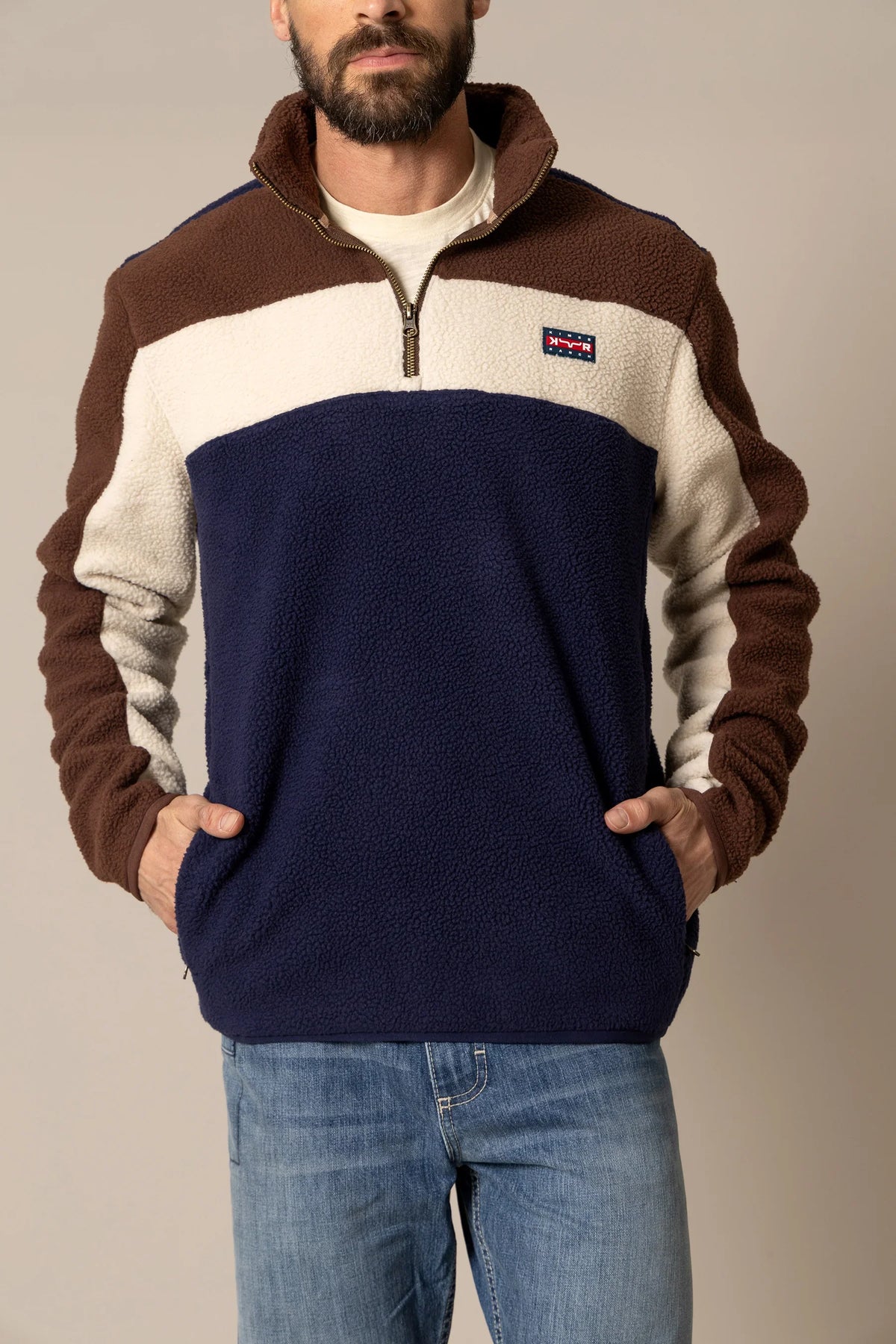 Kimes Ranch JMJ Quarter Zip sweatshirt in Navy with brown and cream colorblocking and a Kimes Ranch logo patch