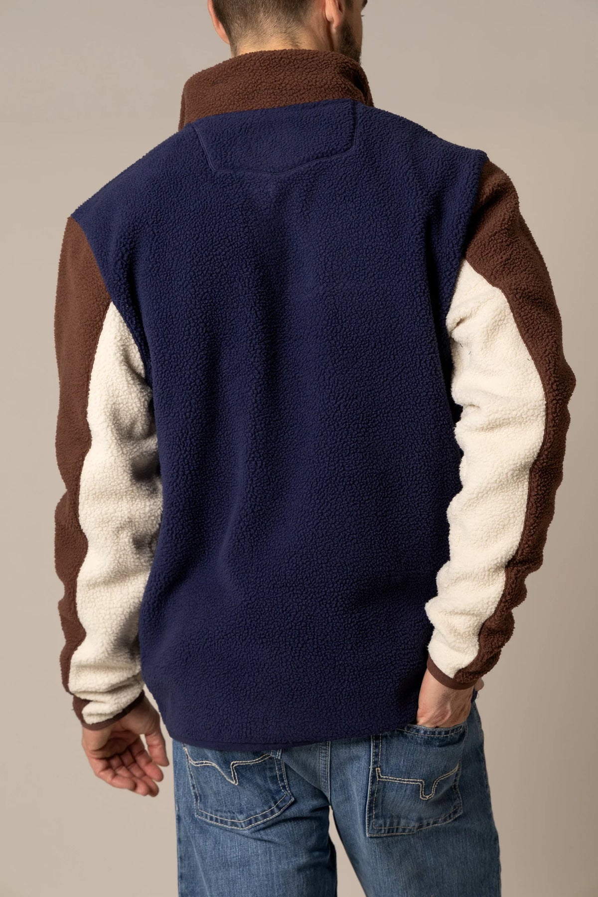 Kimes Ranch JMJ Quarter Zip sweatshirt in Navy, back view, with brown and cream sleeves
