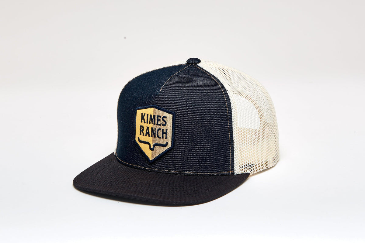 Kimes Ranch Jack Trucker Hat, side view, with a shield logo and mesh back