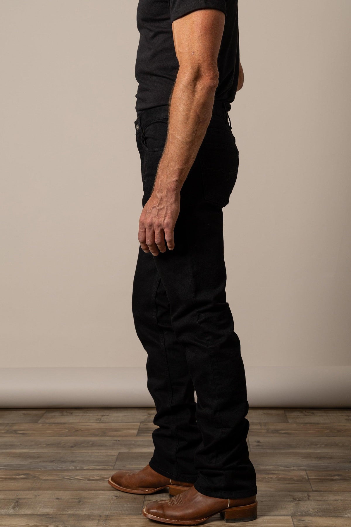 Kimes Ranch James Straight Fit Bootcut jeans in Black, side view, with the leg and pocket detail