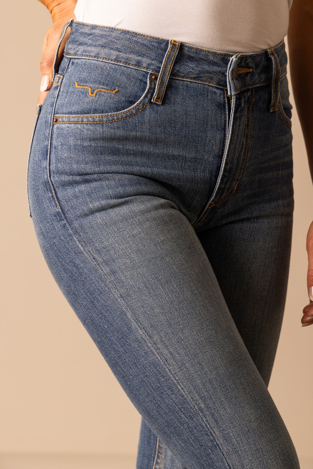 Kimes Ranch Jennifer jeans in Mid Wash, side view, with the front pockets and waistband