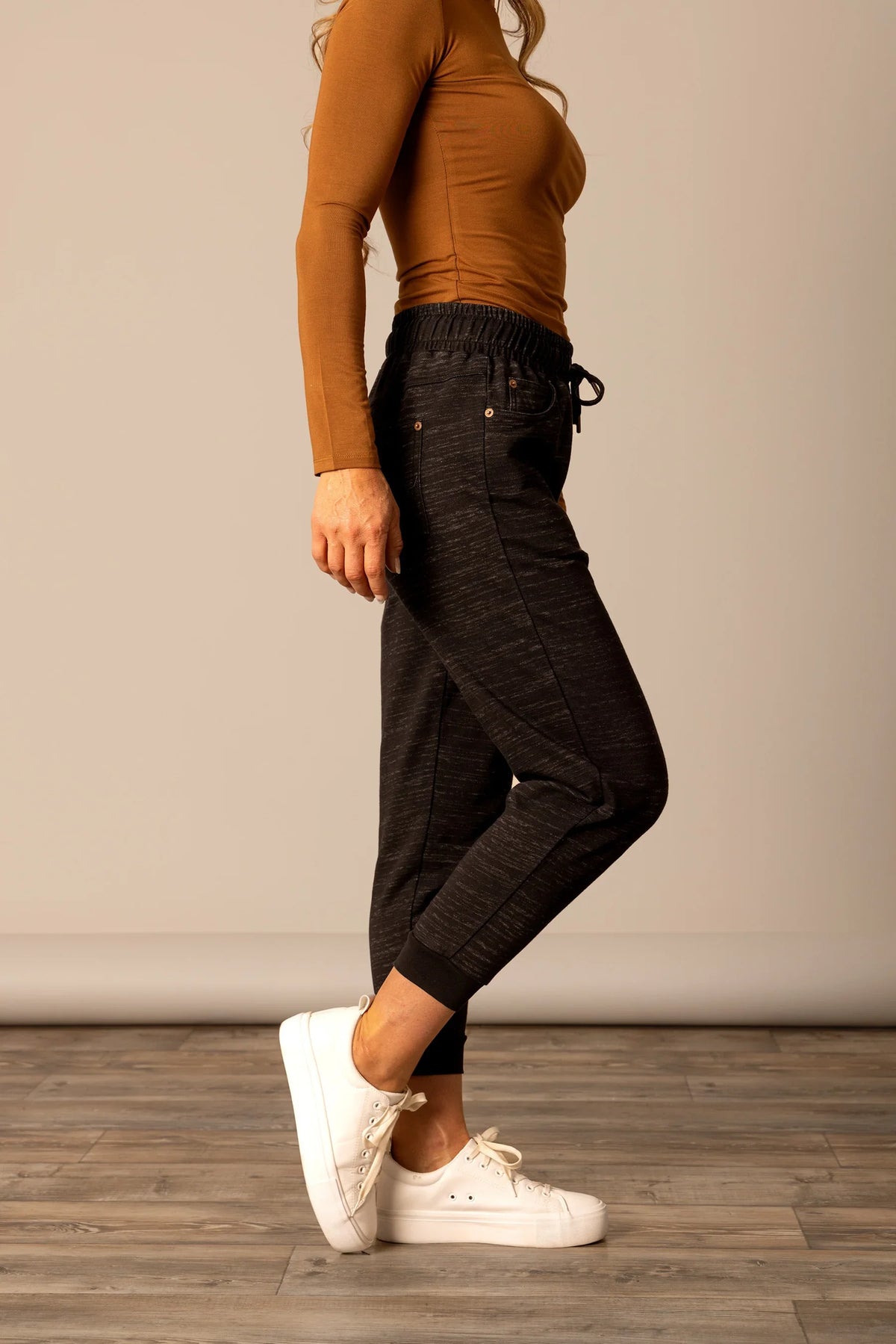 Kimes Ranch Joanie pants in Black, side view, with an elastic waistband and drawstring