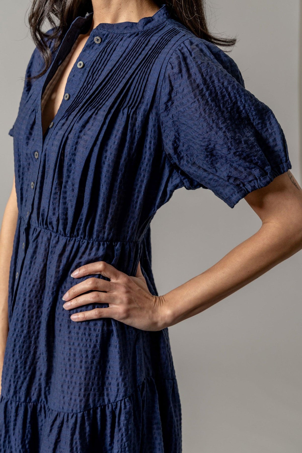 Kimes Ranch Jocelyn Tencel Dress in Blue, side view, with a button front and pleated bodice