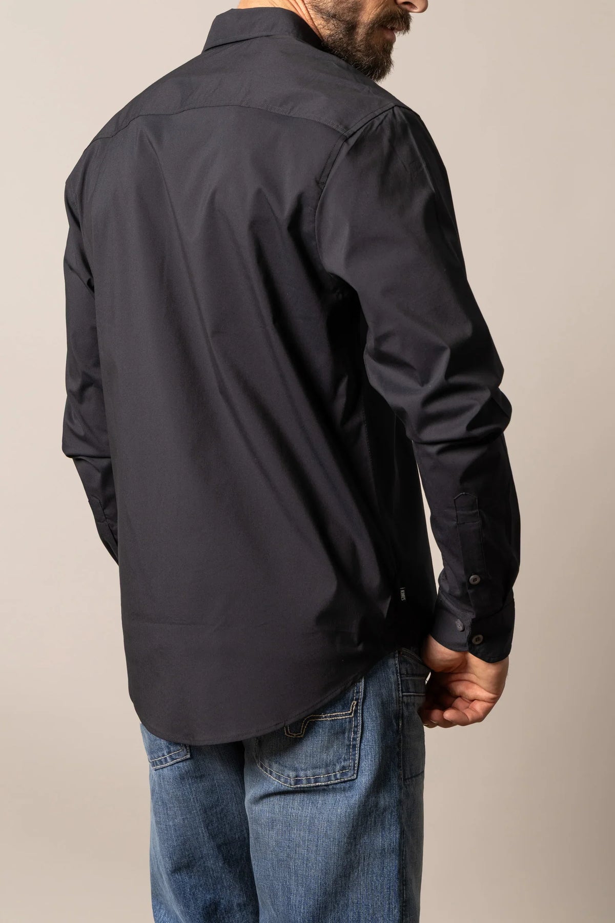 Kimes Ranch KR Team Dress Shirt in Black, back view, with long sleeves and a back yoke