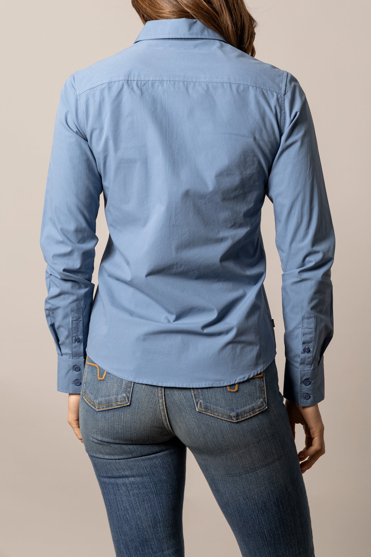Kimes Ranch Ladies KR Team Shirt in Carbon Blue, back view, with long sleeves and button cuffs