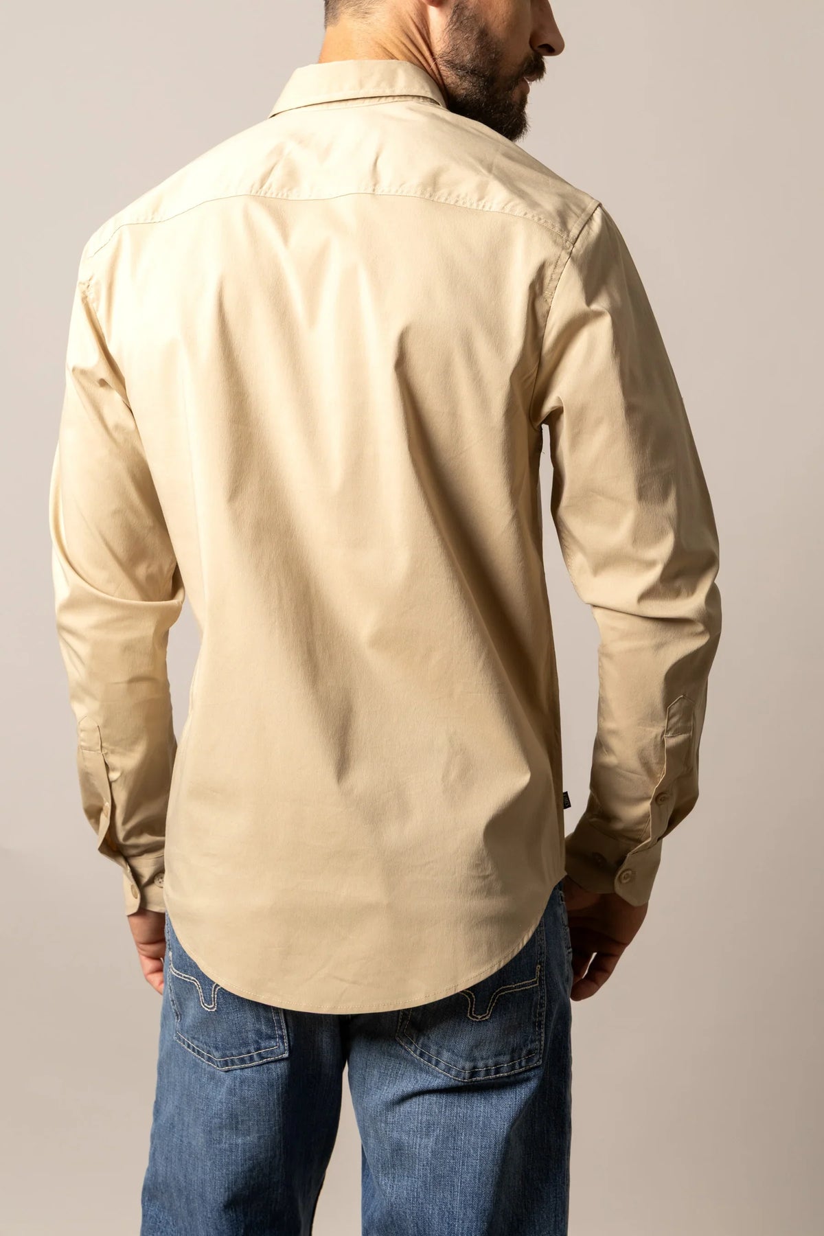 Kimes Ranch KR Team Dress Shirt in Khaki, back view, with a back yoke and long sleeves