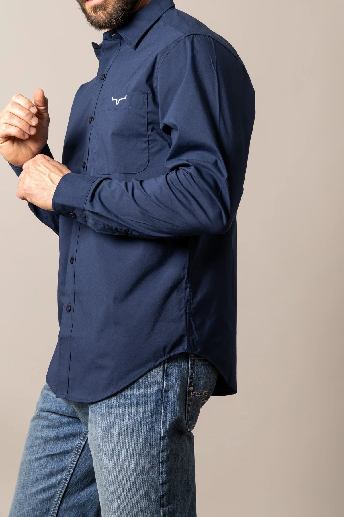 Kimes Ranch KR Team Dress Shirt in Navy, side view, with long sleeves, button front, and chest pocket with logo