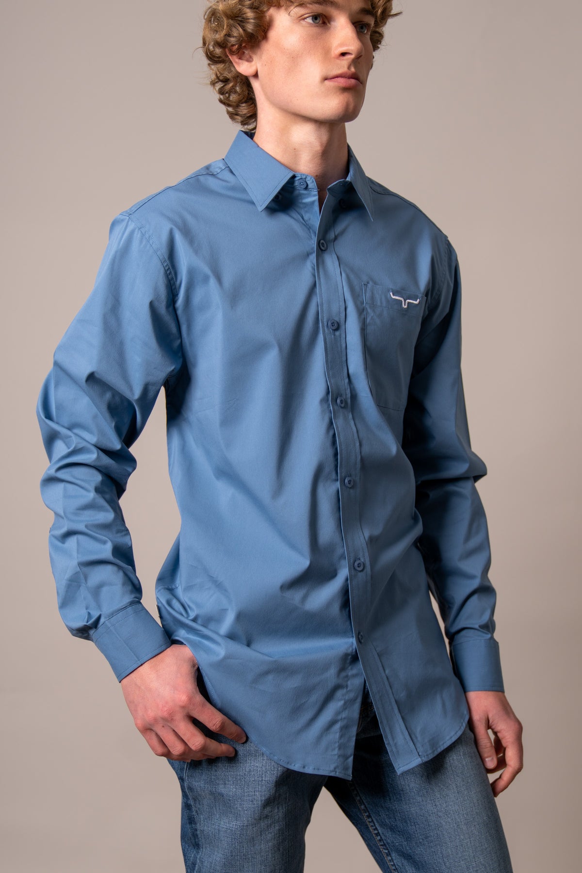 Kimes Ranch KR Team Dress Shirt in Carbon Blue with long sleeves and a chest pocket with logo