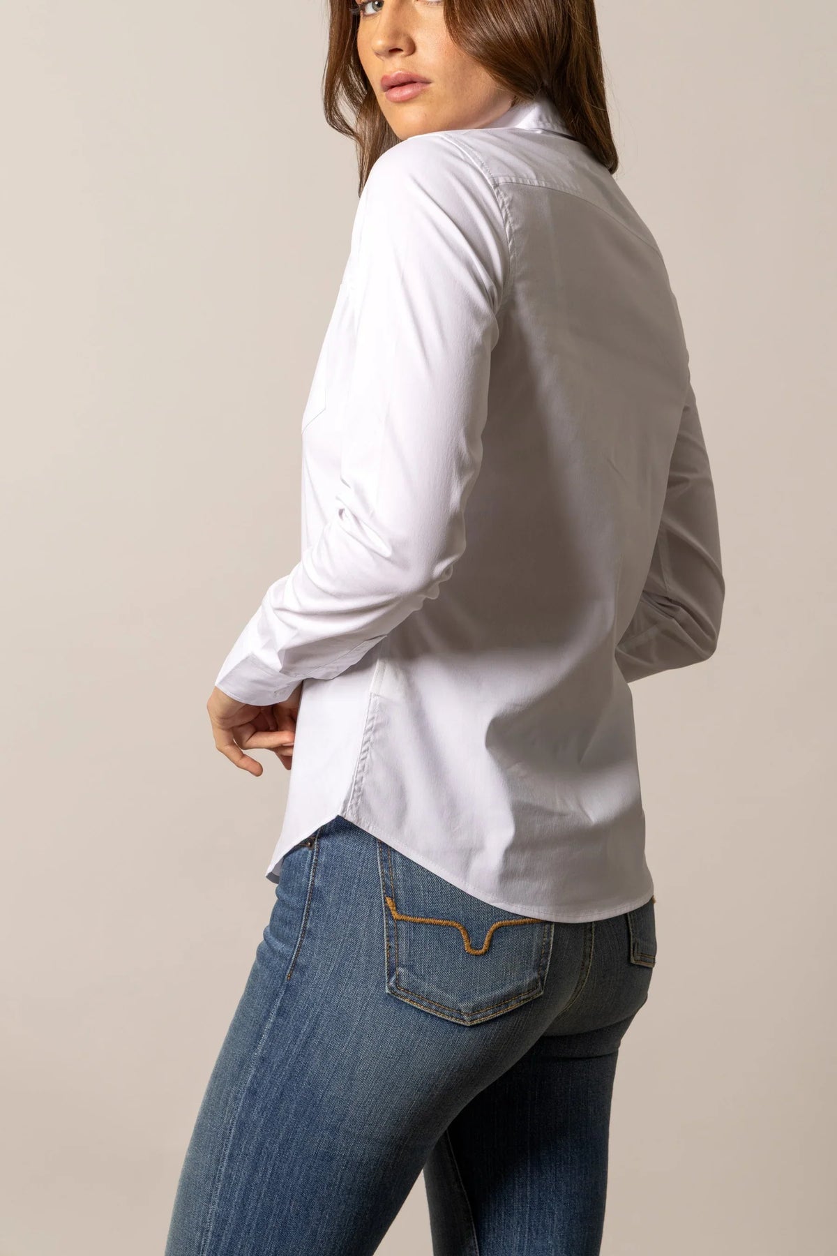Kimes Ranch Ladies KR Team Shirt in White, side view, with long sleeves and a back yoke