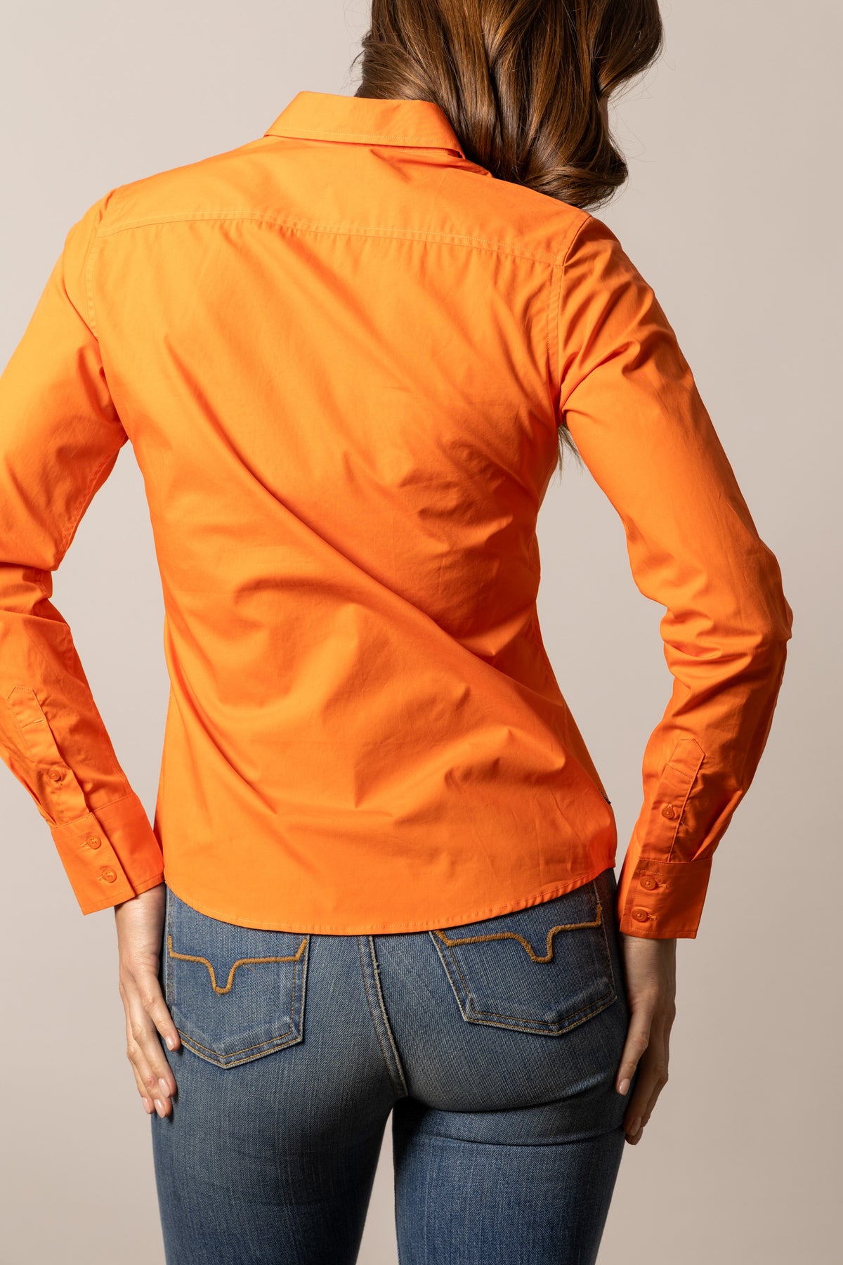Kimes Ranch Ladies KR Team Shirt in Vintage Orange, back view, with long sleeves and a back yoke
