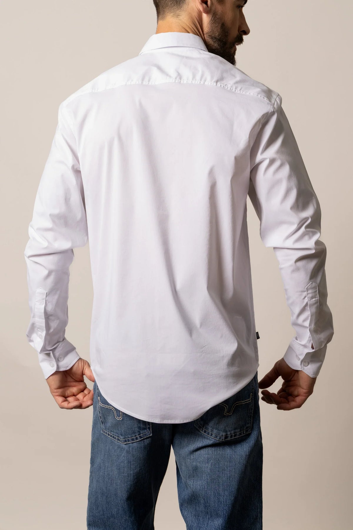 Kimes Ranch KR Team Dress Shirt in White, back view, with long sleeves and button cuffs