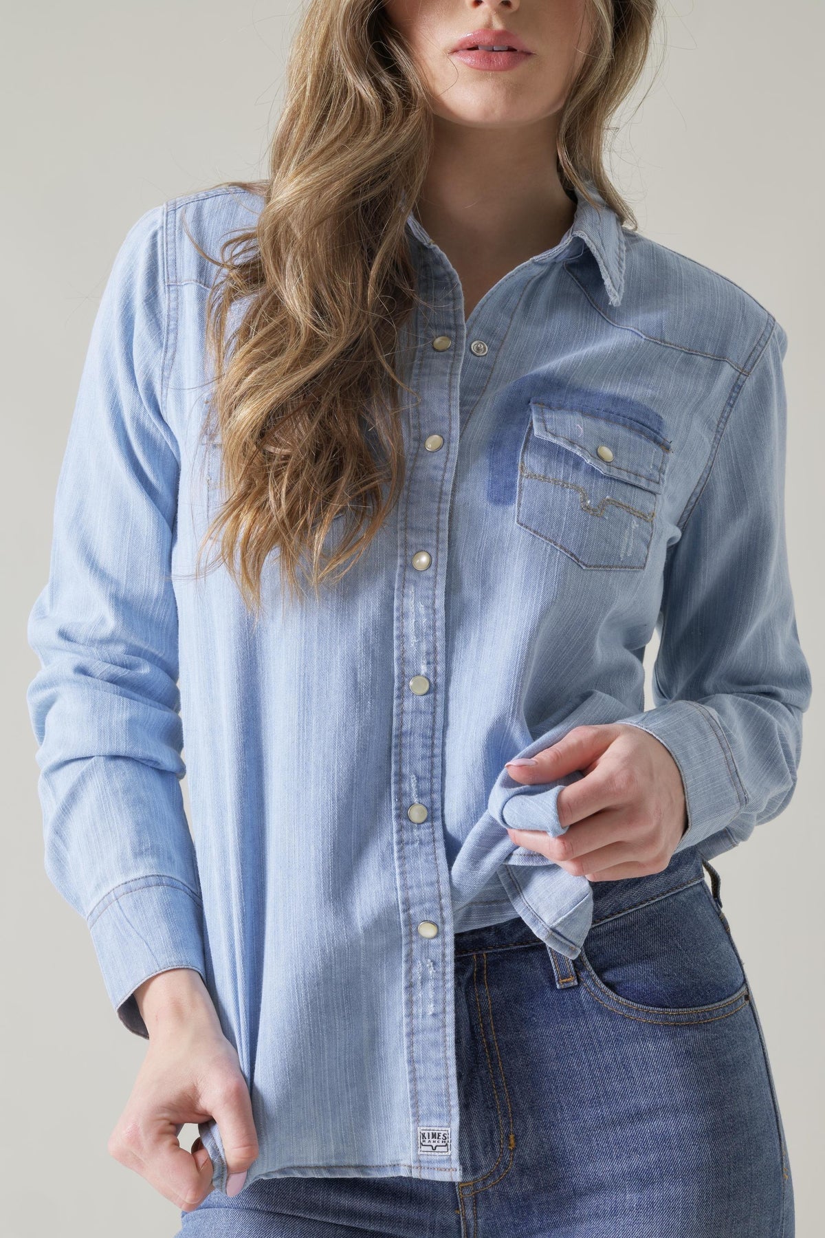Kimes Ranch Kaycee Denim Top in blue with a button front and a chest pocket