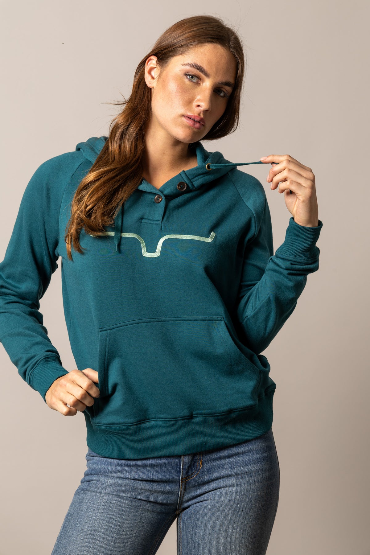 Kimes Ranch Kenzie Hoodie in Dark Teal with a front kangaroo pocket and a light teal graphic print