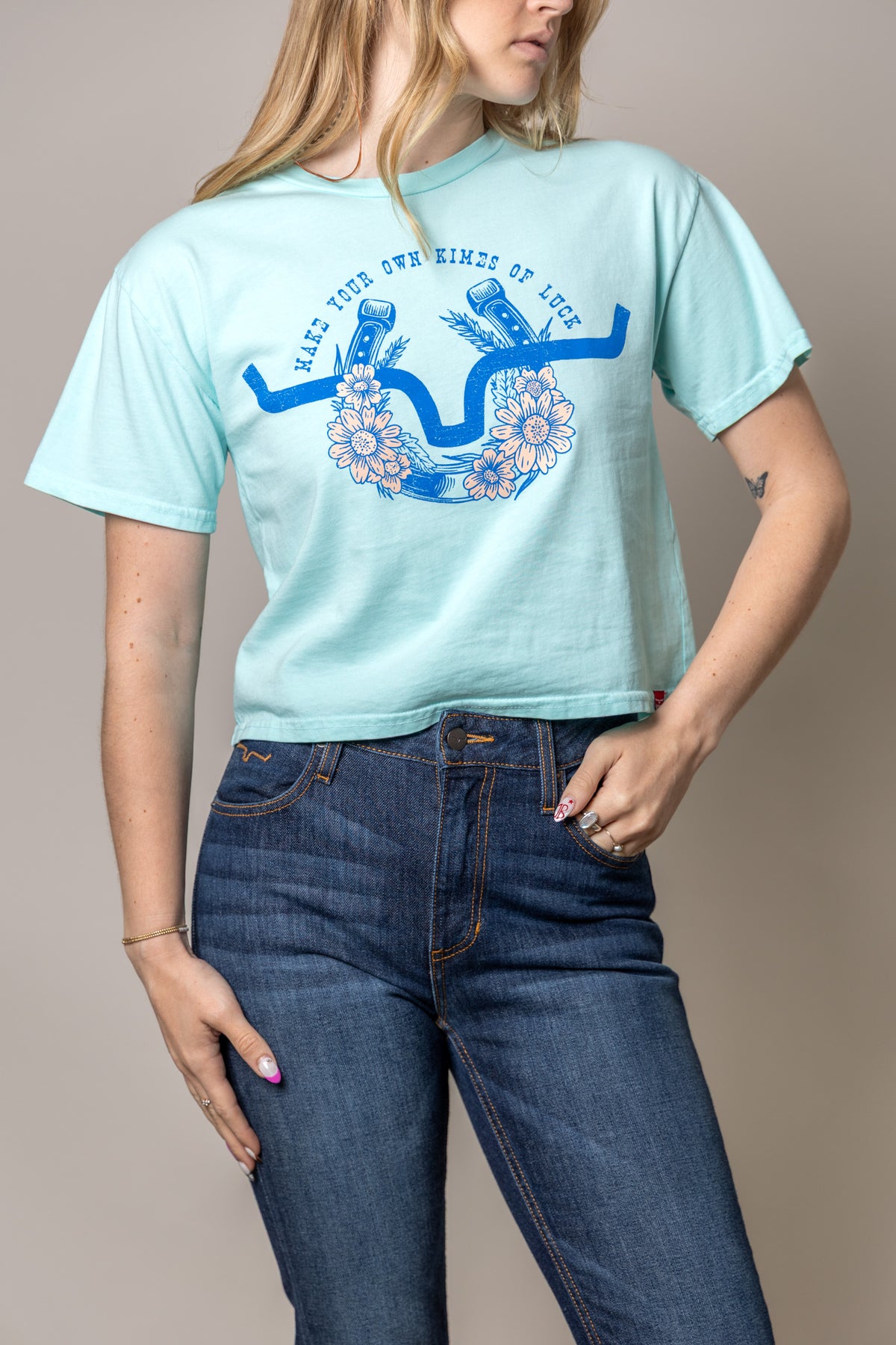 Kimes Ranch Kimes Of Luck Mint t-shirt with a blue horseshoe graphic and floral design