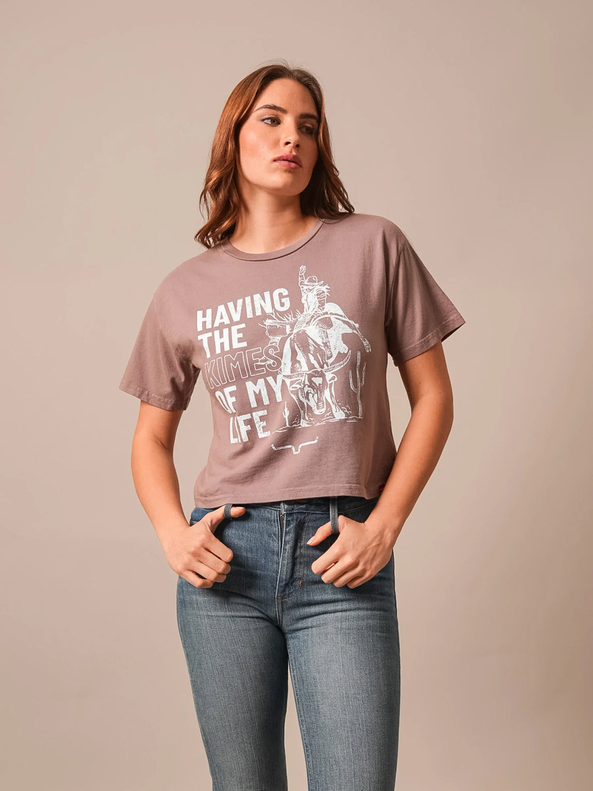 Kimes Ranch Kimes Of My Life short sleeve crewneck shirt in Mocha with a white graphic of a cowboy on a bucking horse