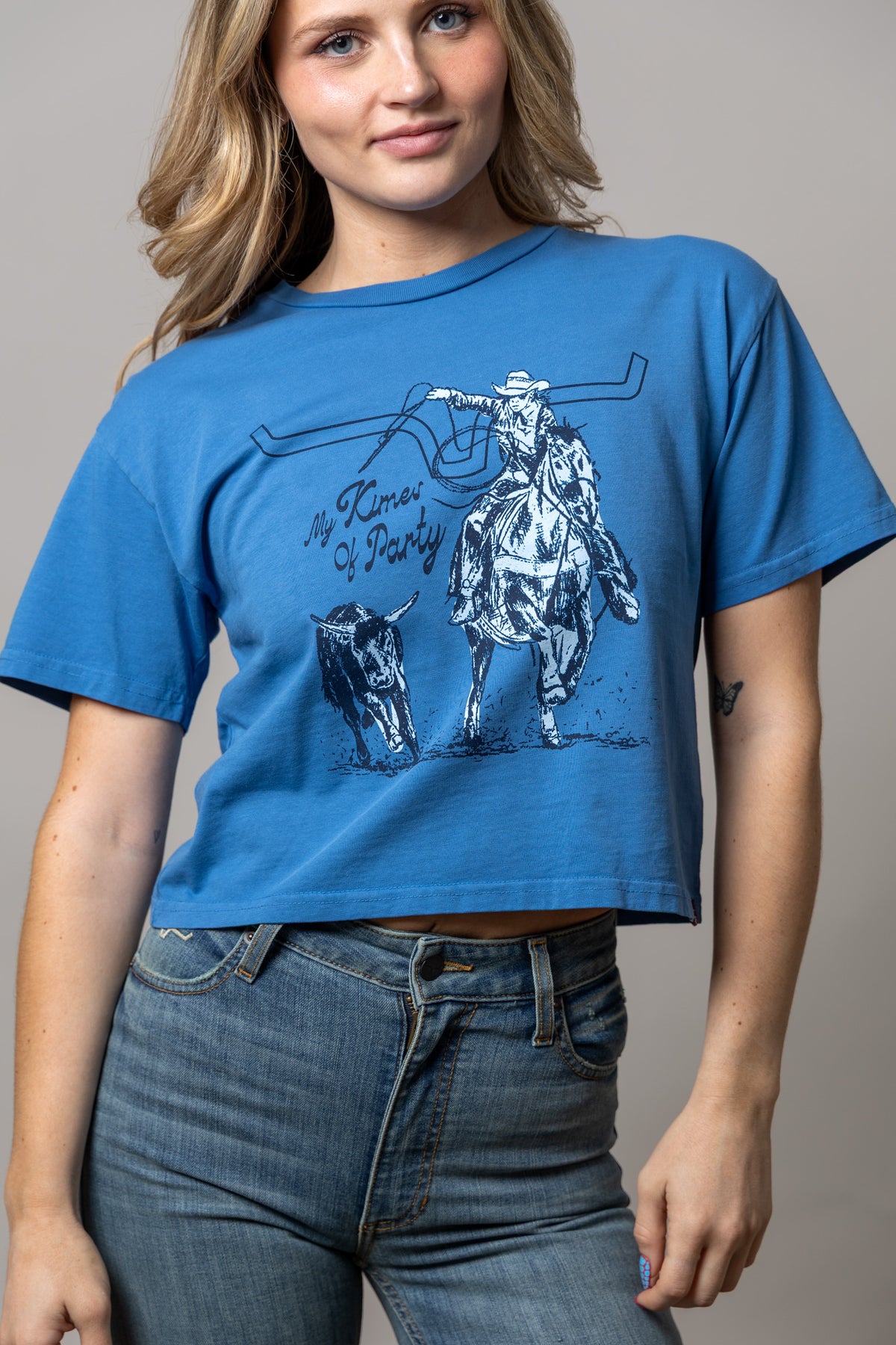 Kimes Ranch Kimes Of A Party shirt in Carbon Blue with a cowboy on horseback graphic and My Kimes Of Party text