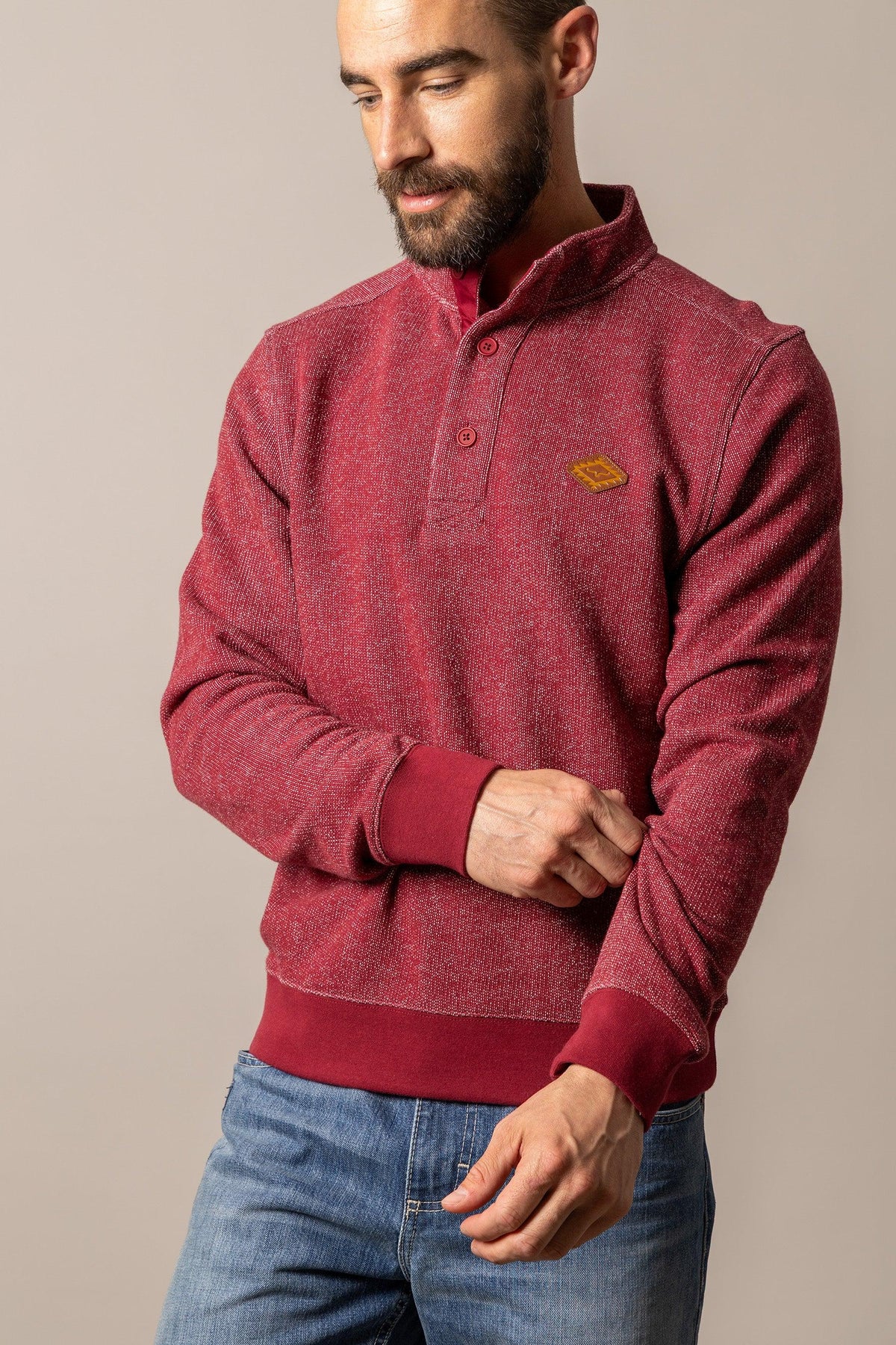 Kimes Ranch Kingswell sweatshirt in Red with a half-button placket and a logo patch on the chest