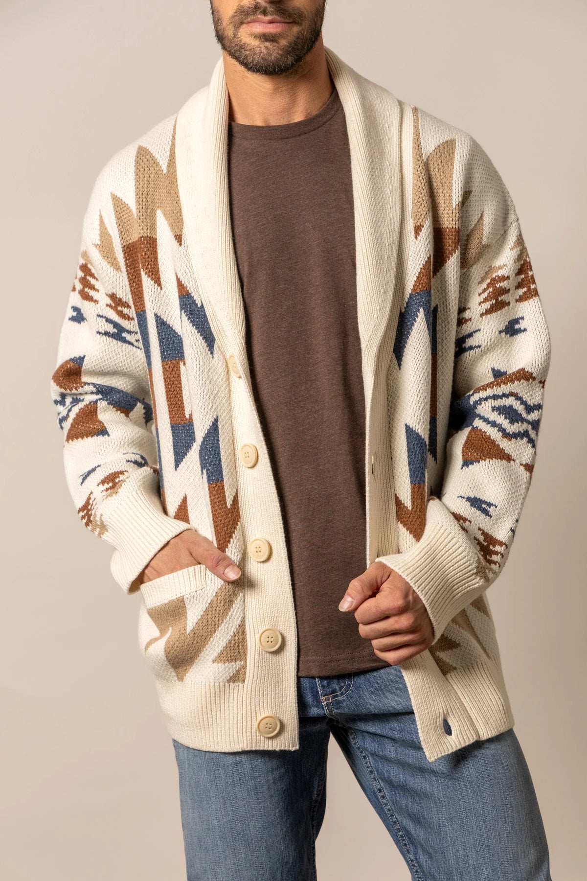Kimes Ranch Knox Cardigan in Natural with a geometric pattern in brown and blue and front patch pockets