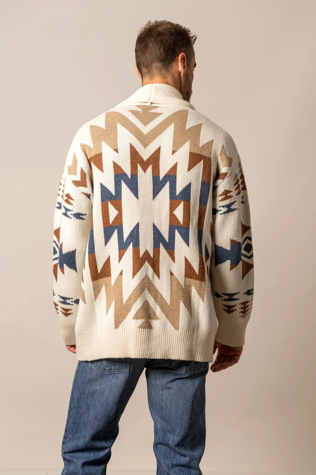 Kimes Ranch Knox Cardigan in Natural, back view, with a large geometric pattern on the back with blue and brown accents