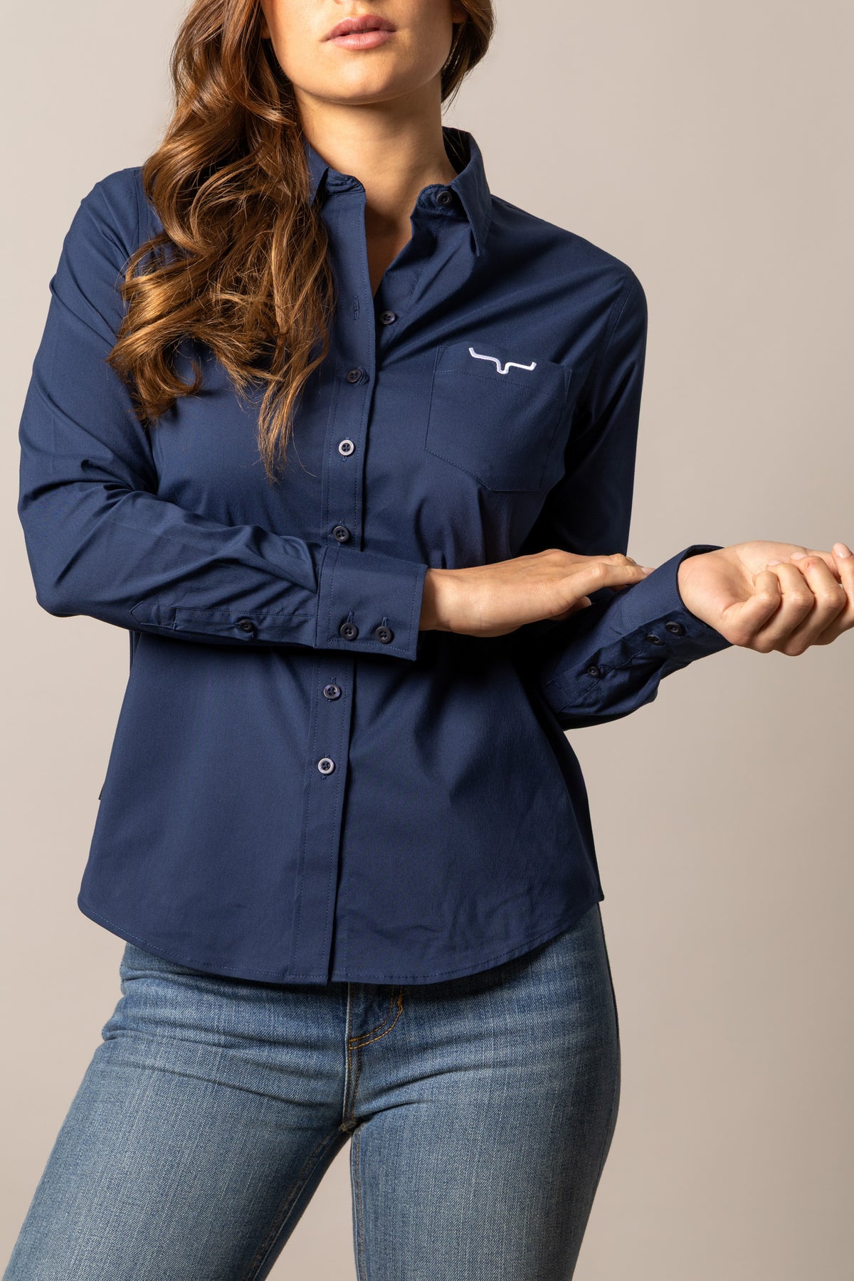 Kimes Ranch Ladies KR Team Shirt in Navy with a button front, long sleeves, and a chest pocket with the Kimes Ranch logo