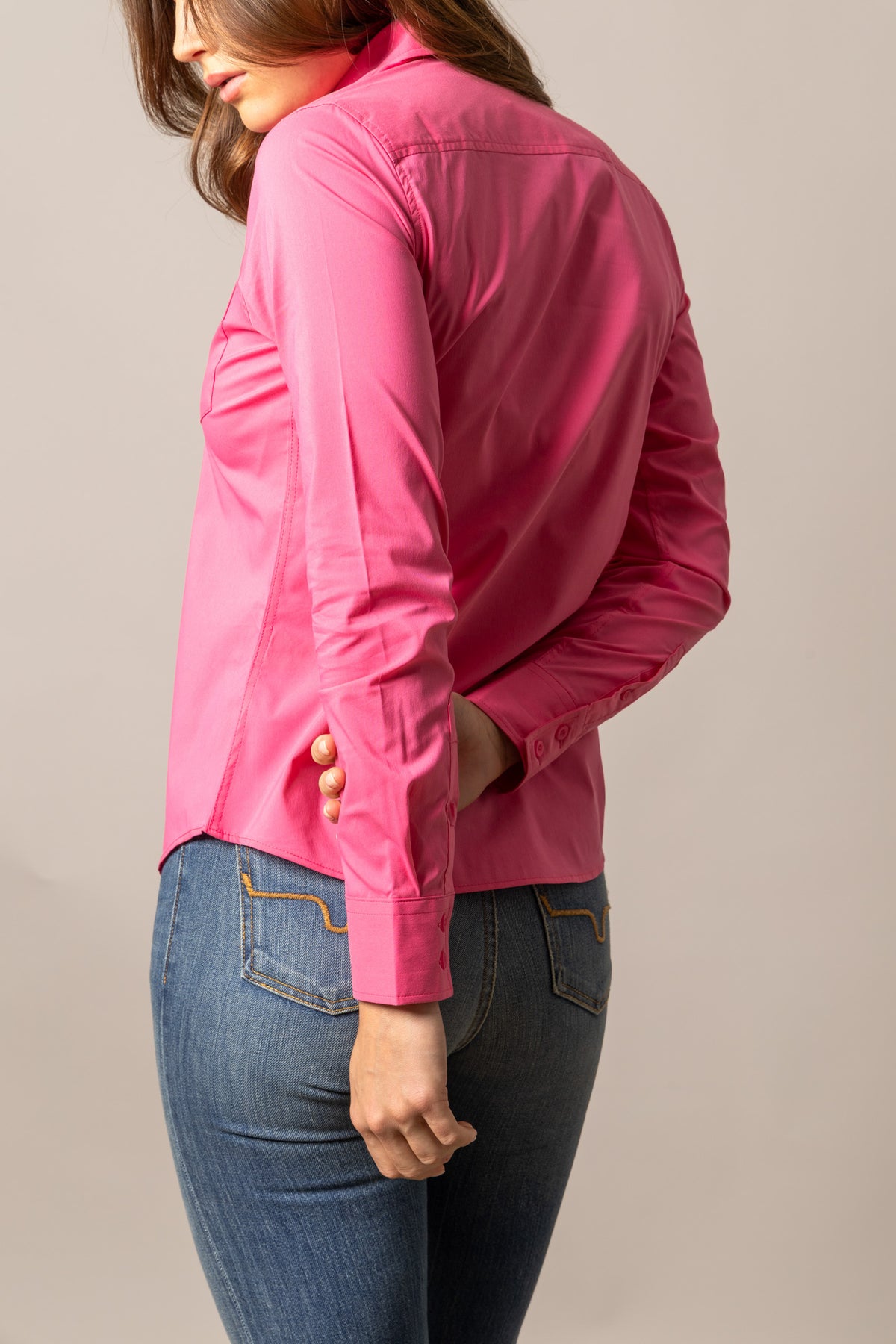 Kimes Ranch Ladies KR Team Shirt in Pink, side view, with long sleeves and a tailored fit
