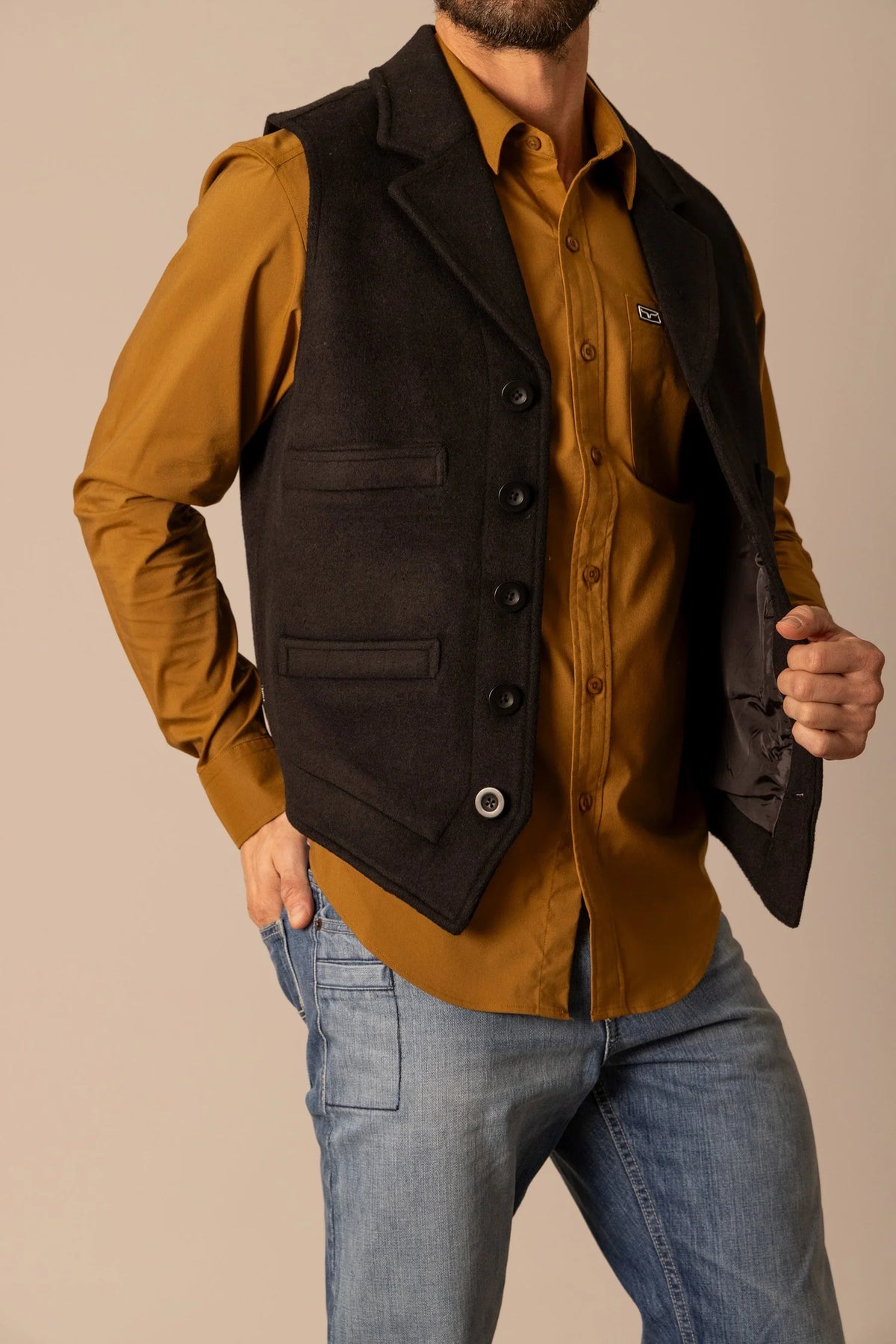 Kimes Ranch Kraken Vest in Black with a button front closure and two flap pockets