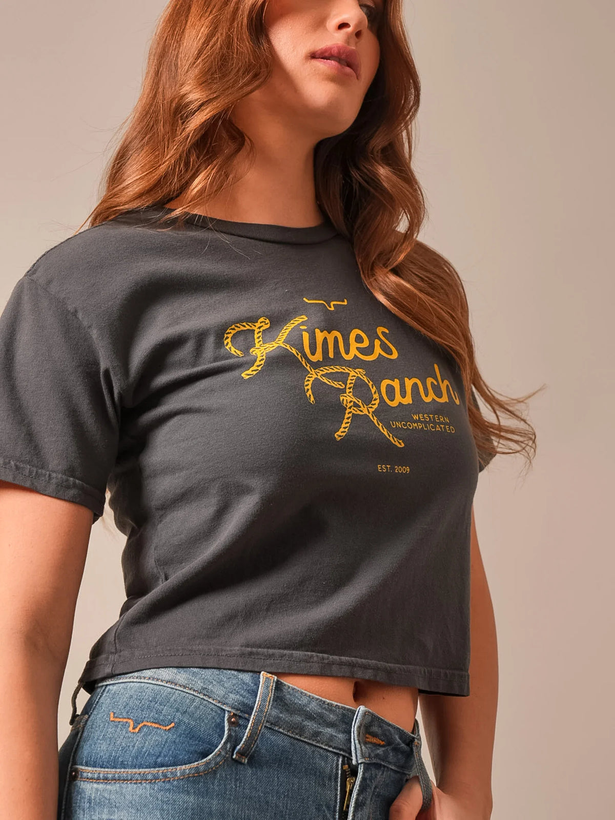 Kimes Ranch Lasso Script shirt in Graphite with a yellow rope-style logo and Western Uncomplicated text