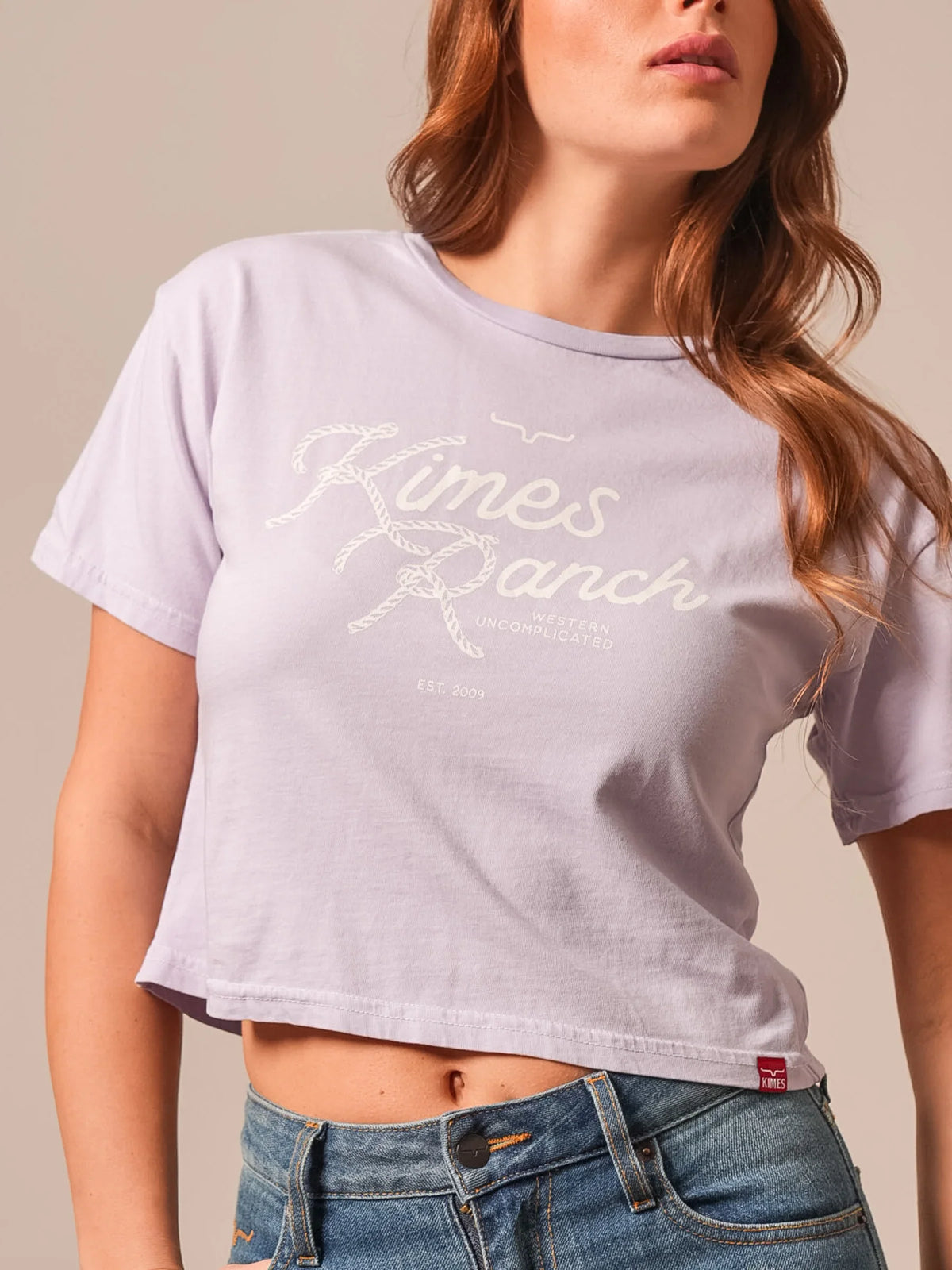 Kimes Ranch Lasso Script shirt in Lavender with rope-style graphic and red hem tag