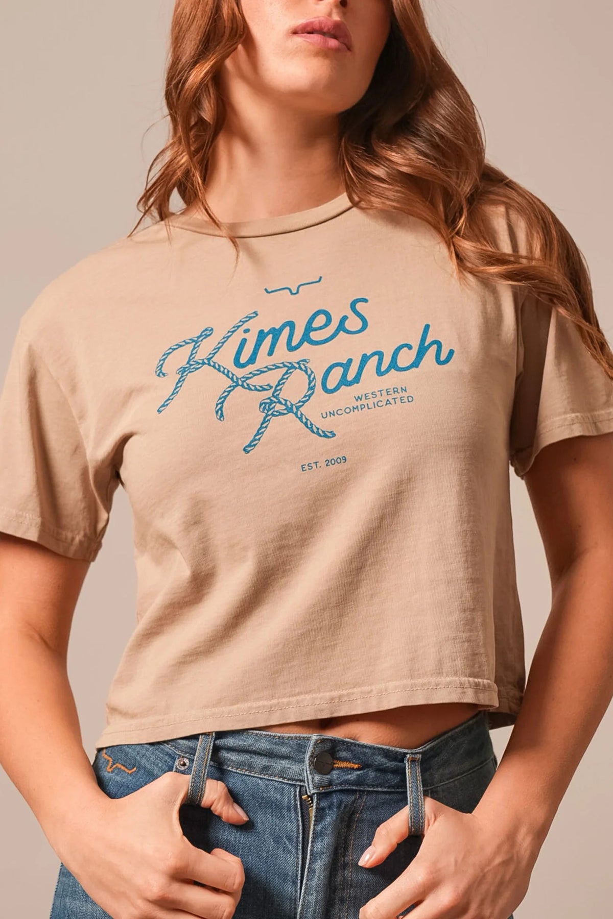 Kimes Ranch Lasso Script shirt in Tan with a blue rope-style graphic print and Western Uncomplicated text