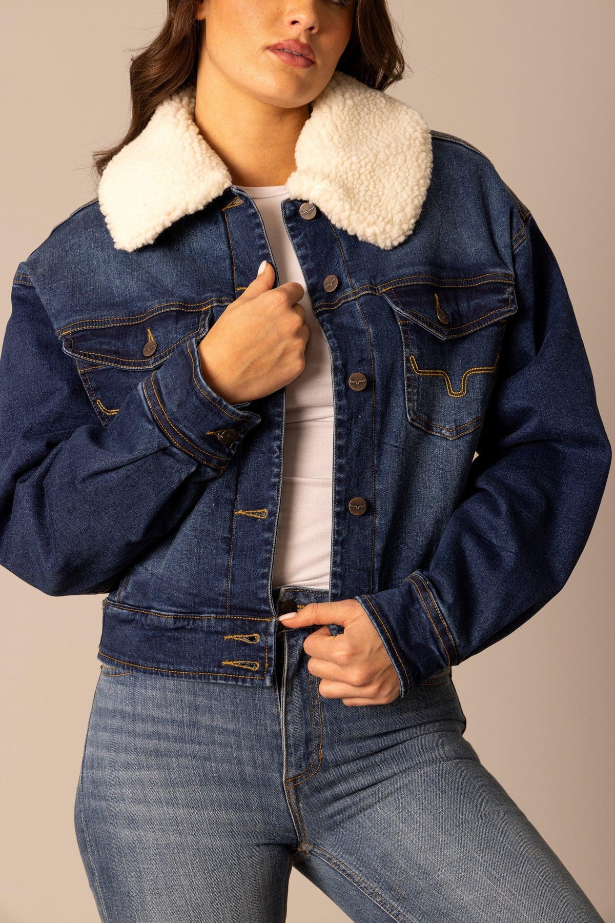 Kimes Ranch Leela Denim Jacket in Dark Indigo with a cream sherpa collar and front flap pockets