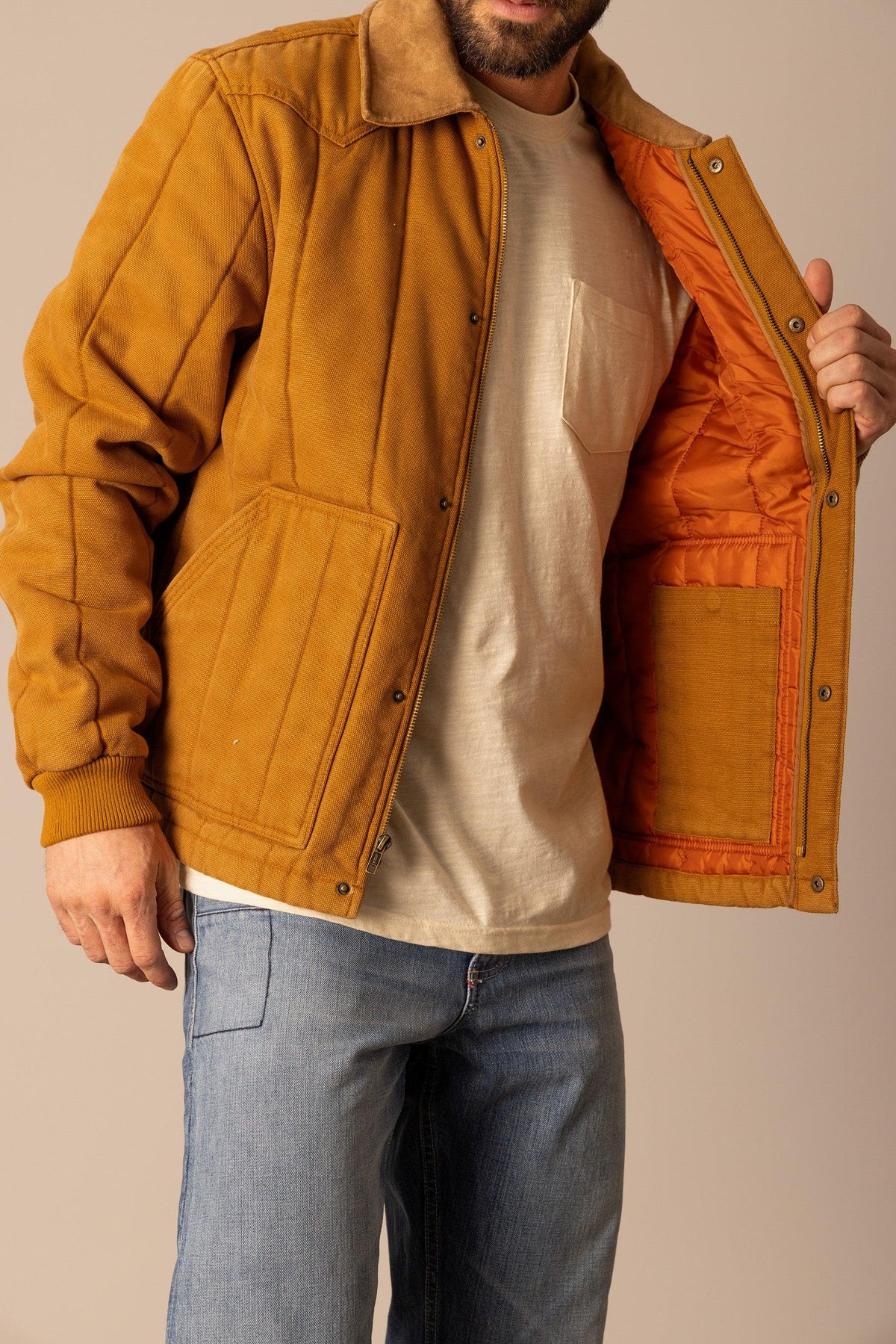 Kimes Ranch Lewiston Jacket in Work Wear Brown with snap front, flap pockets and orange quilted lining
