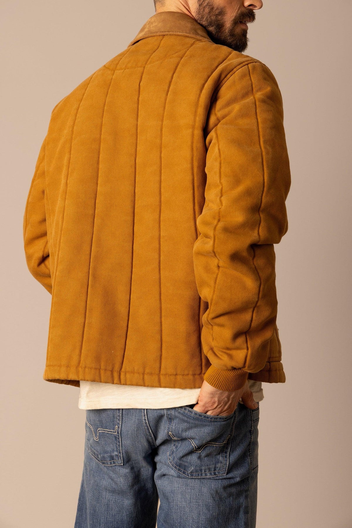 Kimes Ranch Lewiston Jacket in Work Wear Brown, back view, with vertical quilting and ribbed cuffs