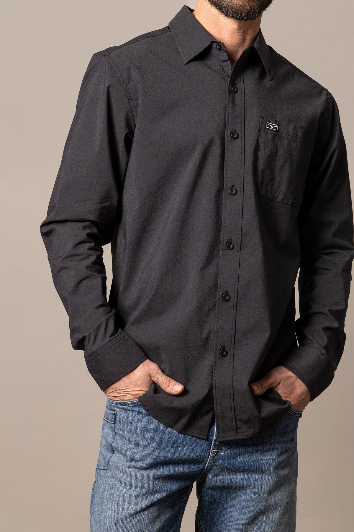 Kimes Ranch Linville Long Sleeve Dress Shirt in Black with a button front and a chest pocket with the Kimes Ranch logo