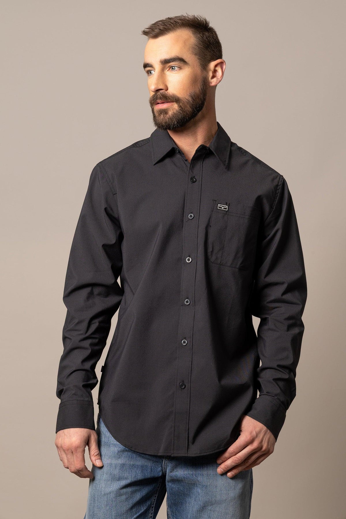 Kimes Ranch Linville Long Sleeve Dress Shirt in Black with a chest pocket and logo patch