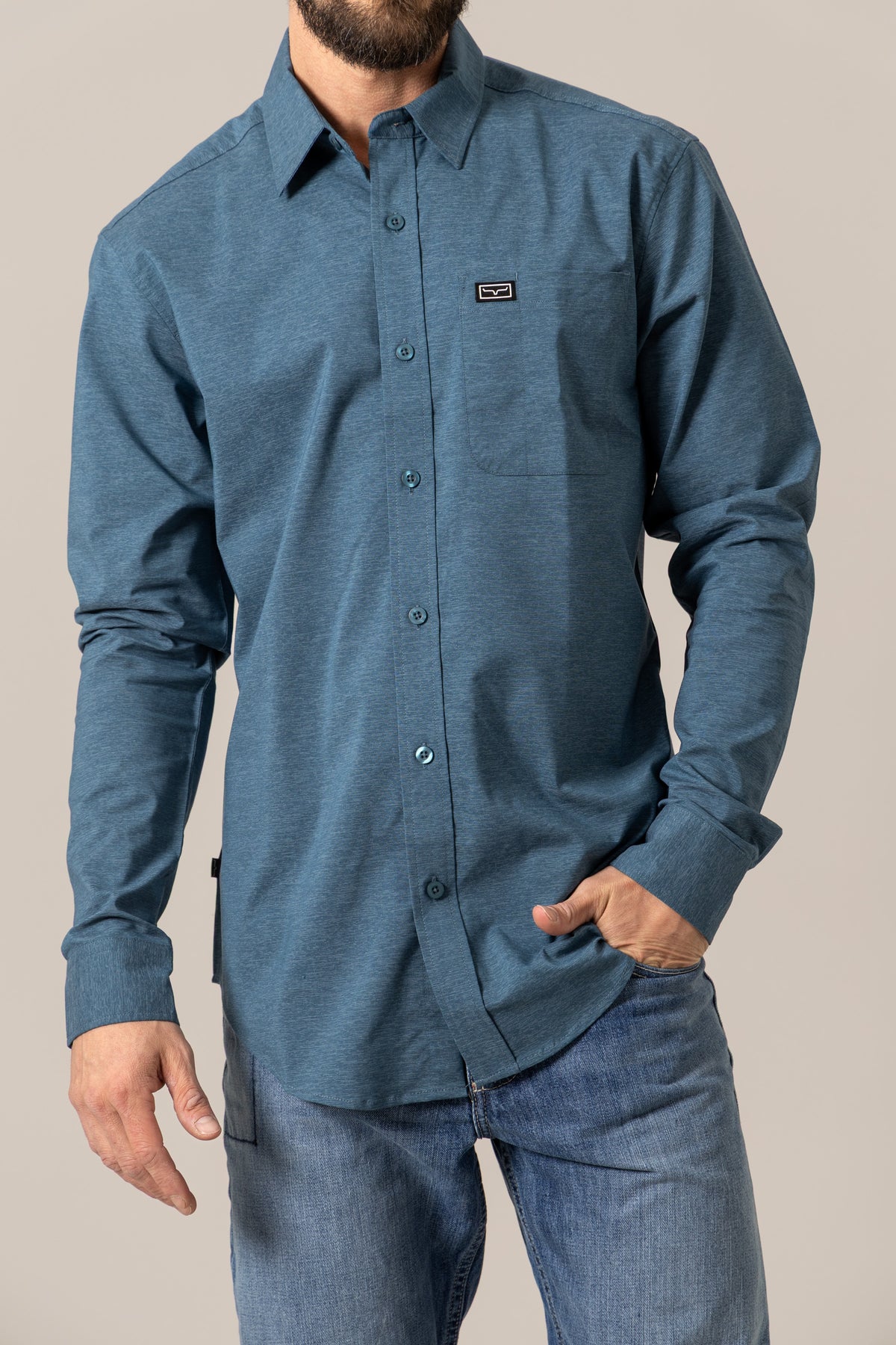 Kimes Ranch Linville Long Sleeve Dress Shirt in Dark Blue with a chest pocket and logo patch