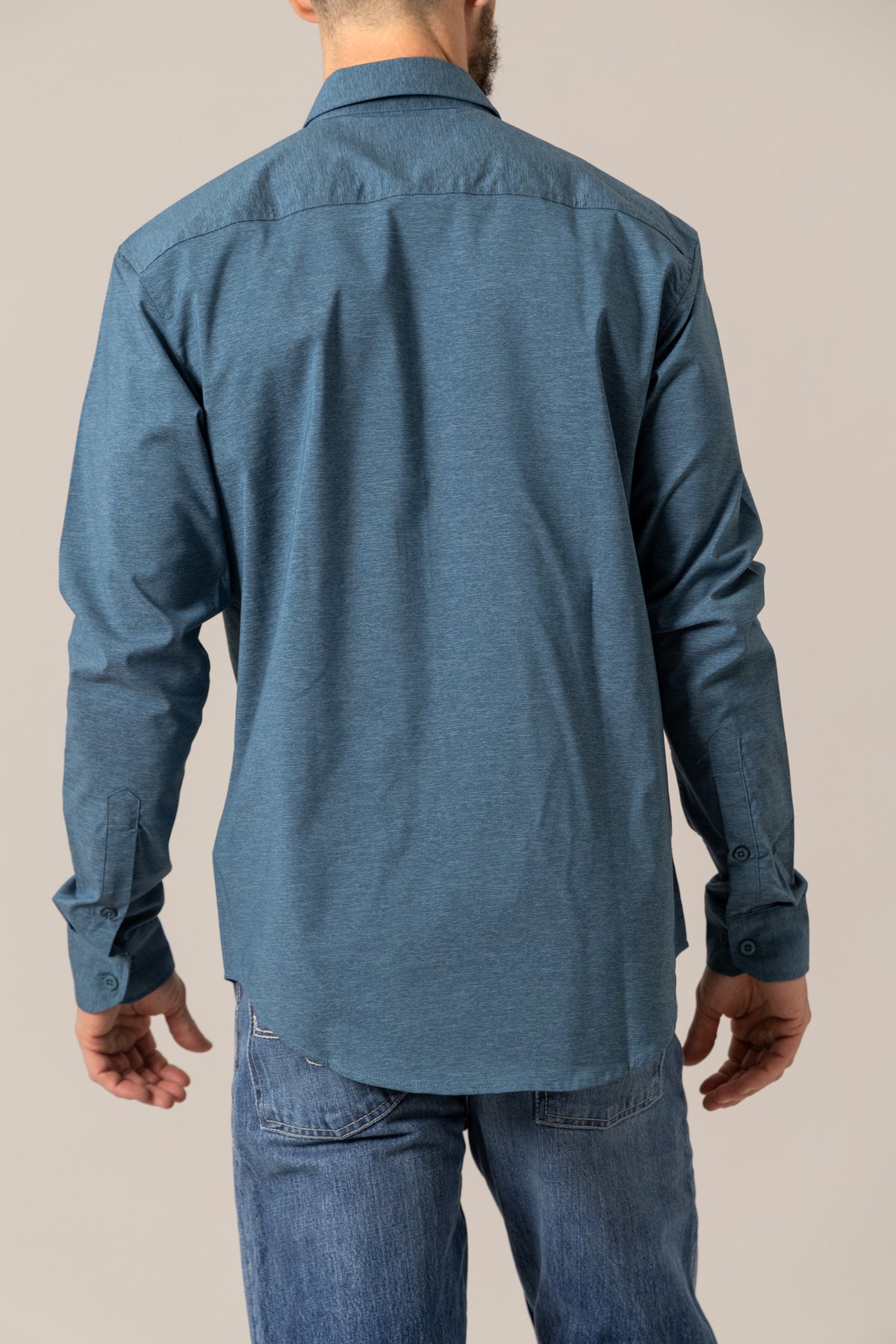 Kimes Ranch Linville Long Sleeve Dress Shirt in Dark Blue, back view, with a back yoke and button cuffs