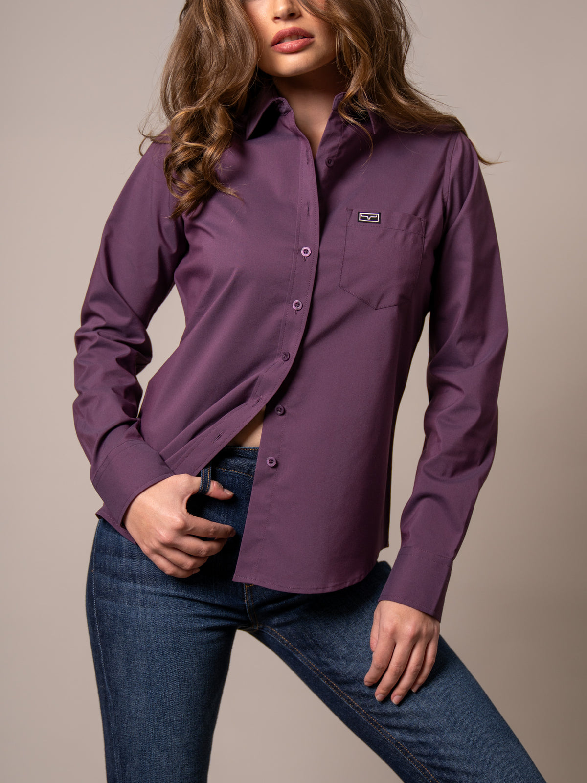 Kimes Ranch Ladies Linville top in Plum with a button front and chest pocket with logo