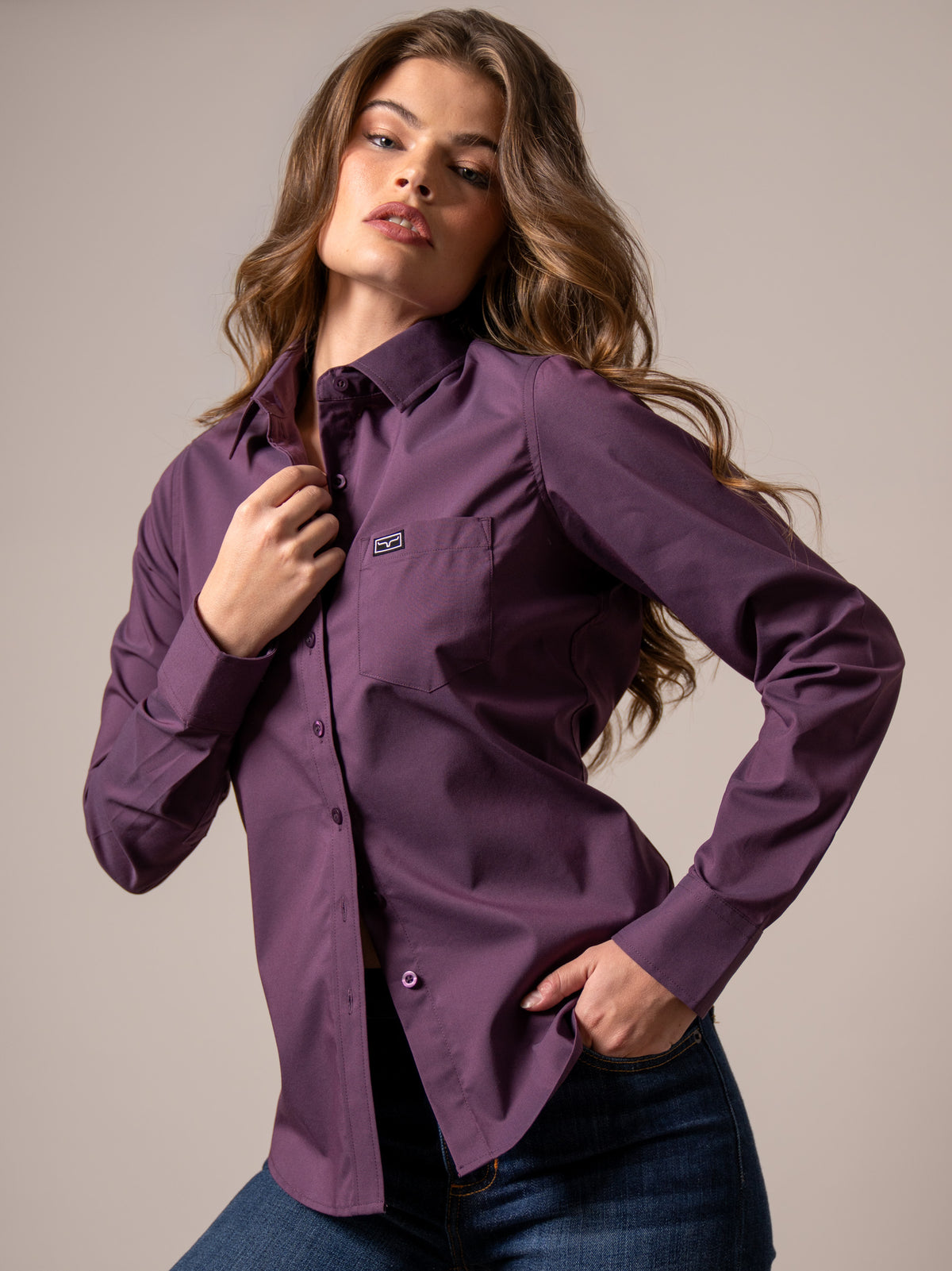 Kimes Ranch Ladies Linville top in Plum with a button front and chest pocket with logo