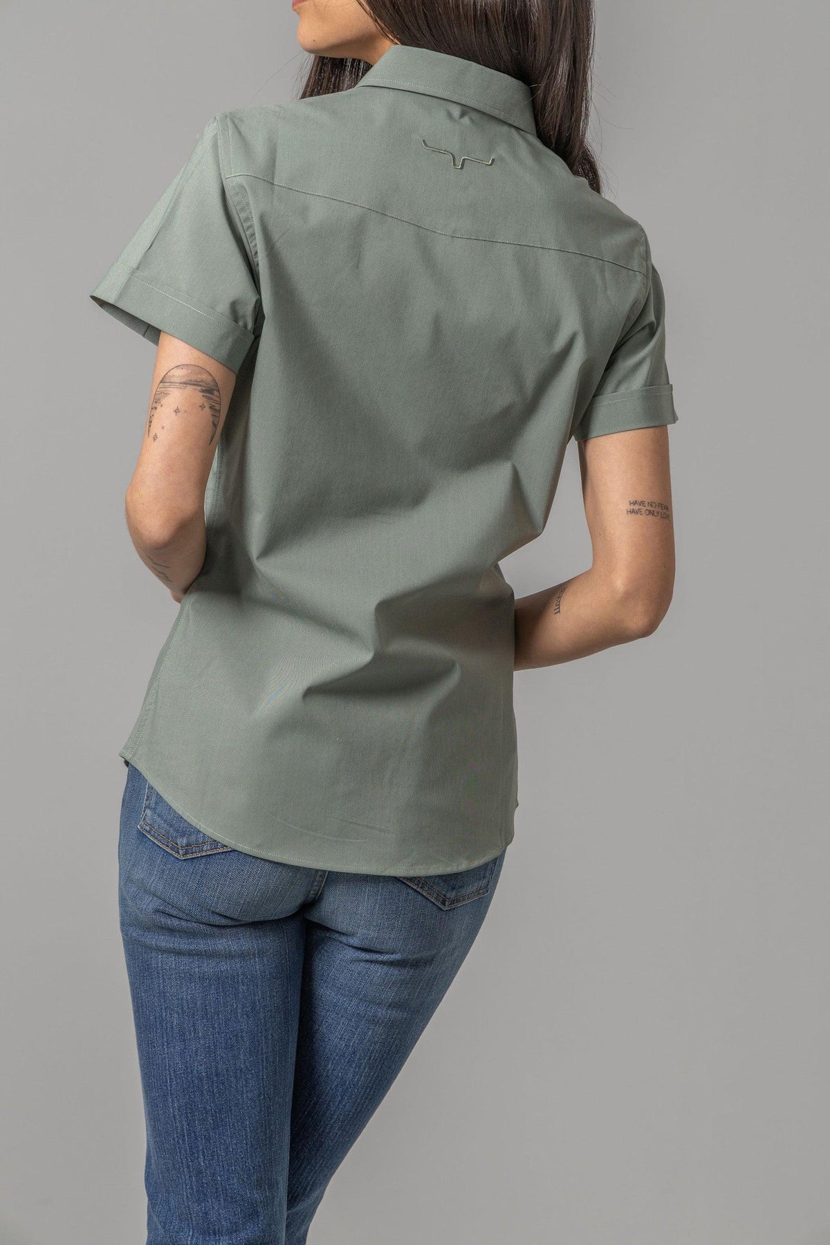 Kimes Ranch Ladies Linville Short Sleeve top in Pine, back view, with a back yoke and embroidered logo