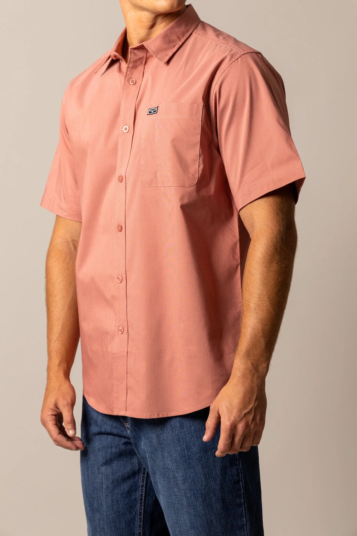 Kimes Ranch Linville Short Sleeve Dress Shirt in Red, side view, with a chest pocket and logo
