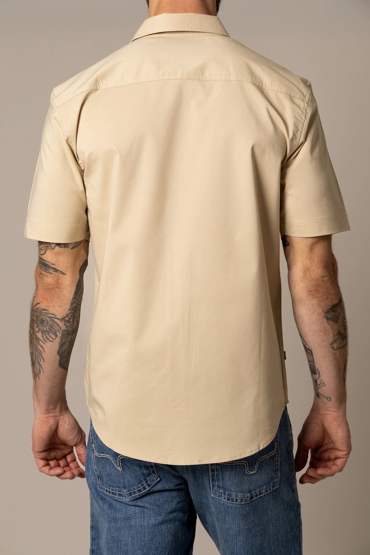 Kimes Ranch Linville Short Sleeve Dress Shirt in Tan, back view, with a back yoke and short sleeves