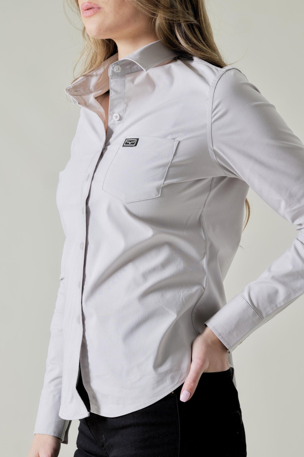 Kimes Ranch Ladies Linville top in Silver White, side view, with a chest pocket and logo