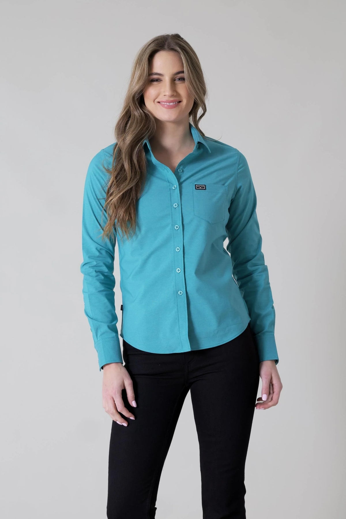 Kimes Ranch Ladies Linville long sleeve button-up top in Teal with a chest pocket and logo patch