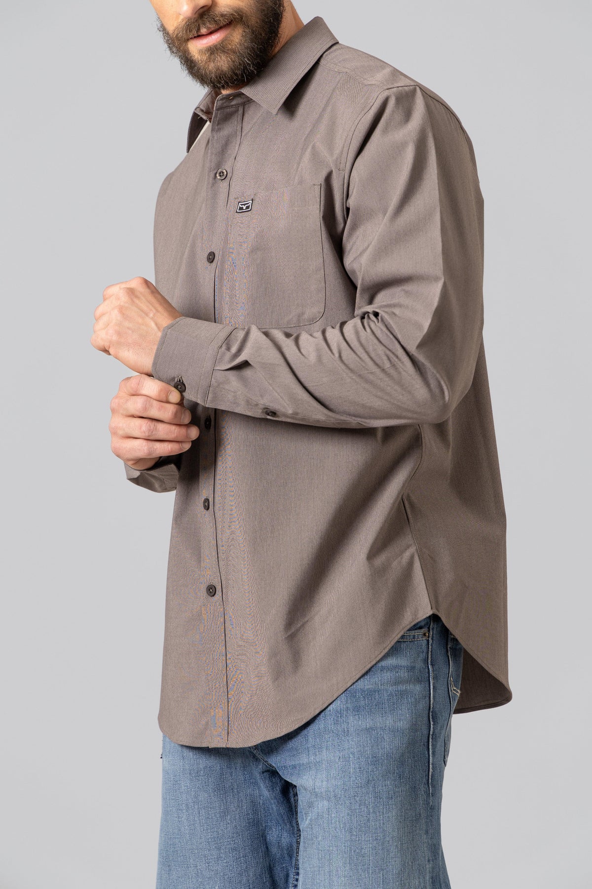 Kimes Ranch Linville Long Sleeve Dress Shirt in Brown, side view, with a chest pocket and logo