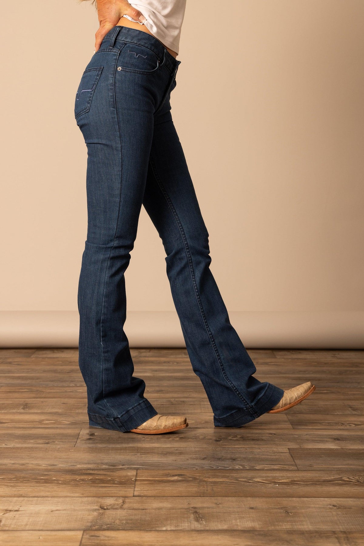 Kimes Ranch Lola jeans in Dark Wash, side view, with a flared leg and contrast stitching